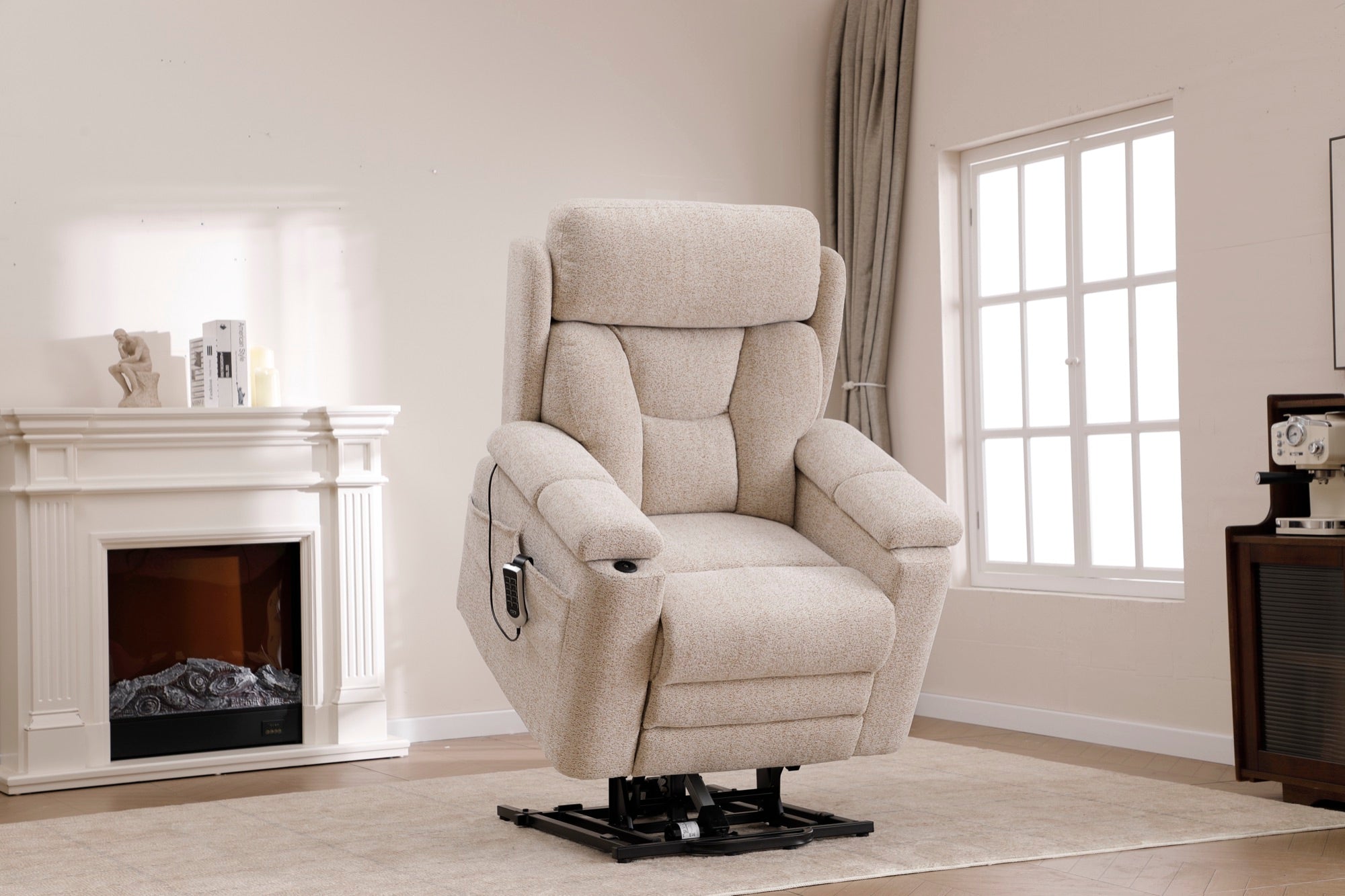 Dynox X5 zero-gravity recliner upright in a sunlit modern living room with fireplace and arched window · Designed in New Jersey