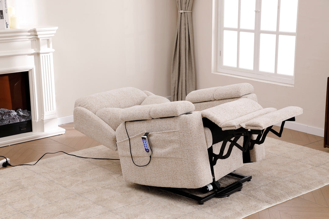 Dynox X5 power recliner in zero-gravity position with extended footrest in a modern living room · Designed in New Jersey